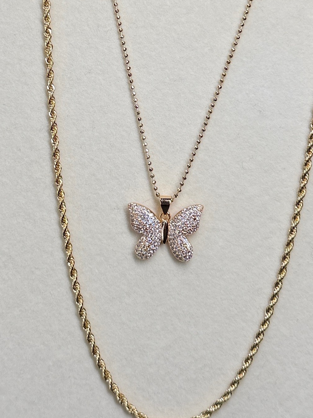 18K triple plated Rose Gold, 18” thin bead chain w/Rose Gold Butterfly Pendant.